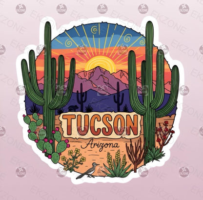 A flat, isolated vinyl sticker featuring a vibrant Southwestern cartoon illustration of a towering Saguaro cactus silhouette against a brilliant orange, pink, and purple Tucson desert sunset sky.
