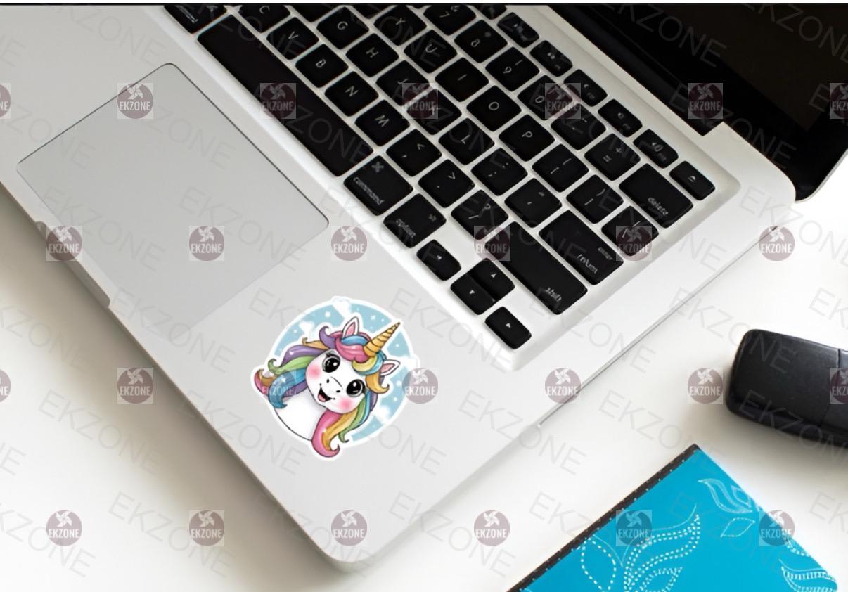 Laptop with a unicorn sticker on the palm rest area