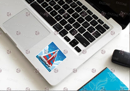 Laptop with a sticker on the palm rest area, placed on a white surface.
