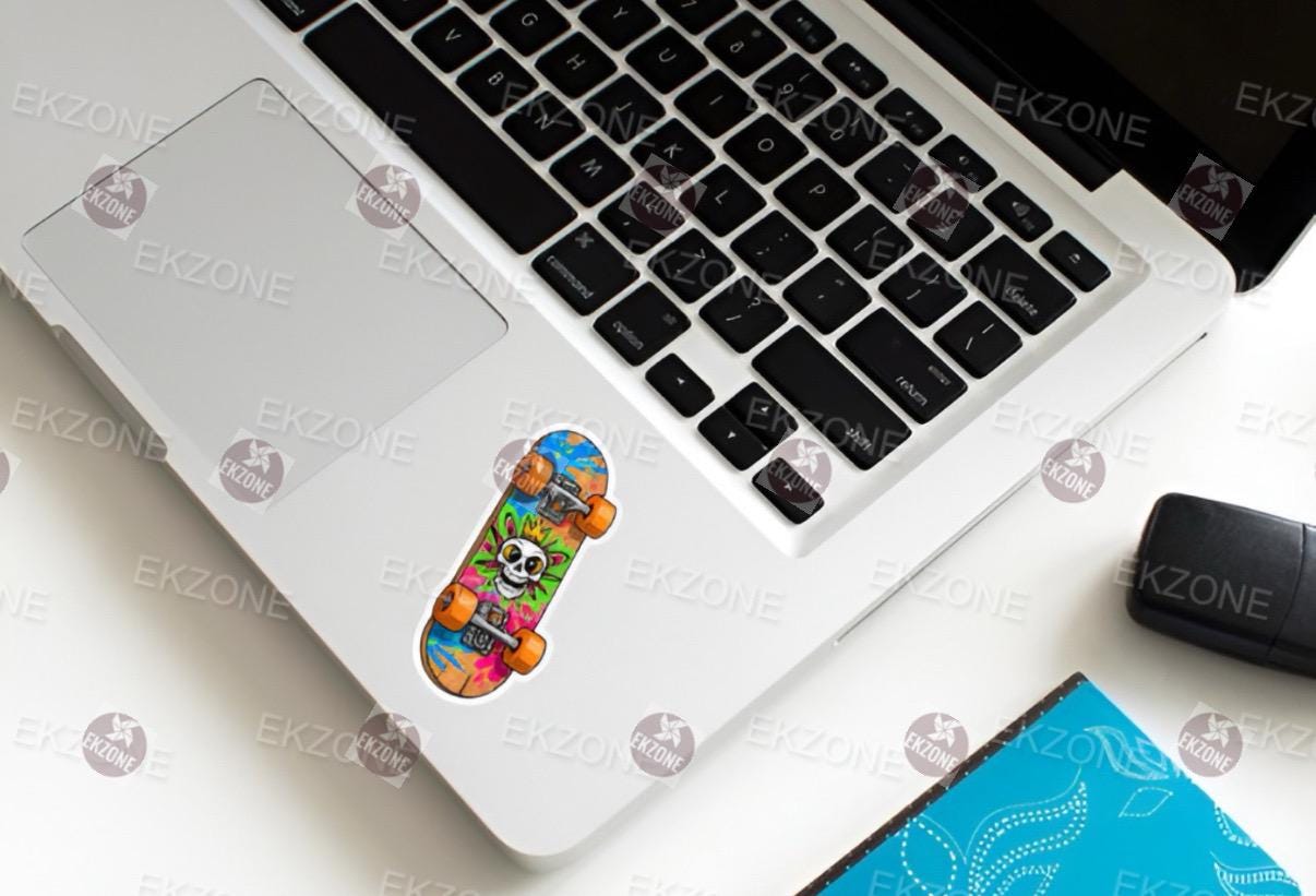 Laptop with a colorful sticker on the palm rest area.