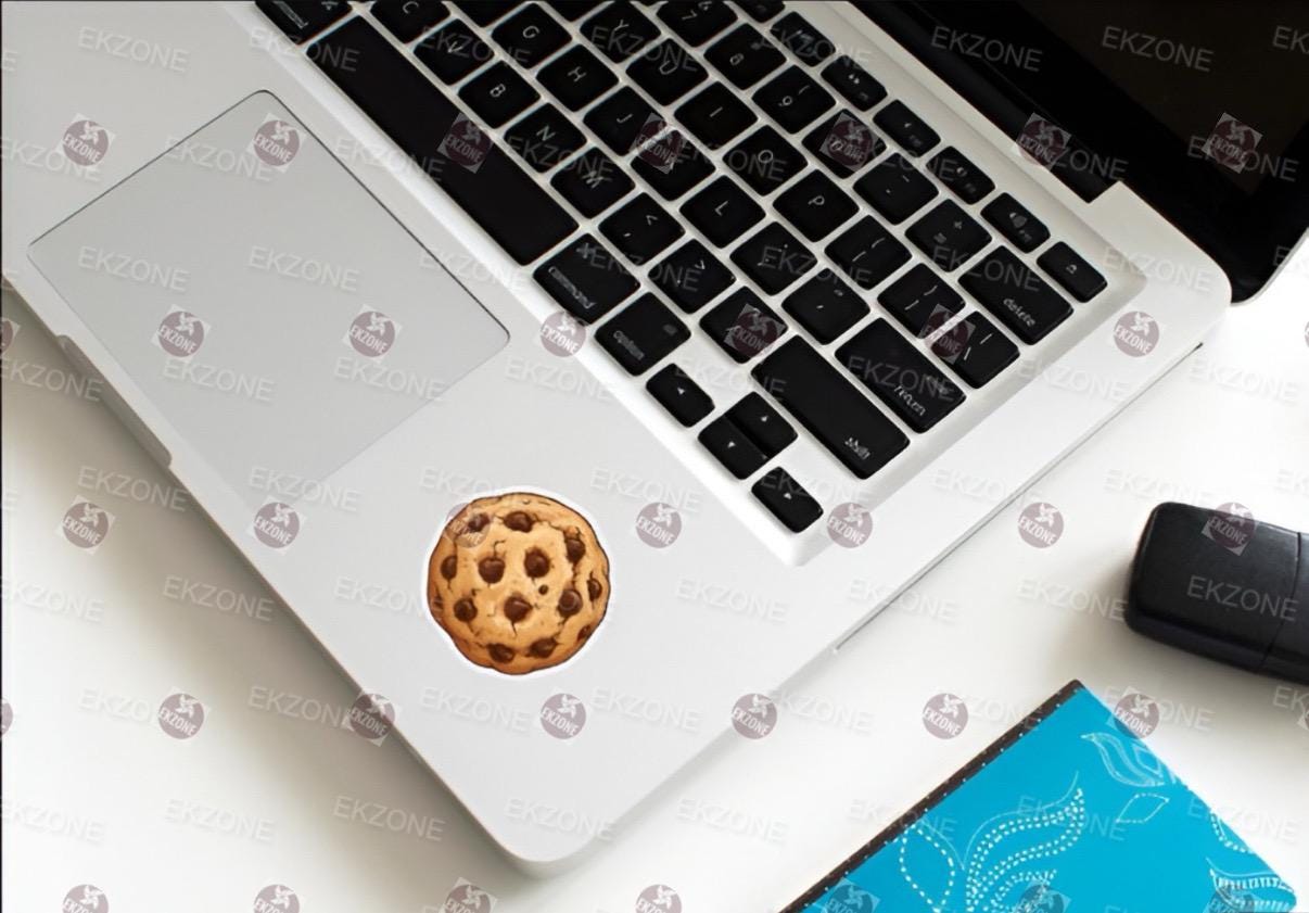 Laptop with a cookie sticker on the palm rest area.
