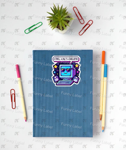 Blue notebook with a sticker on a white surface with stationery items