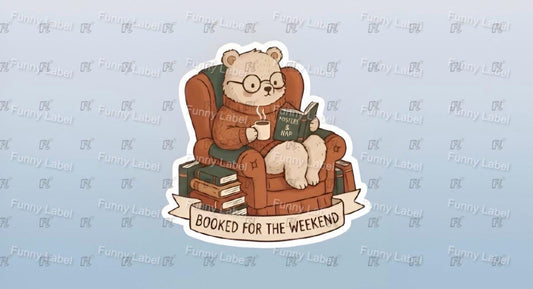 Cartoon bear reading a book with 'Booked for the Weekend' text on a light blue background