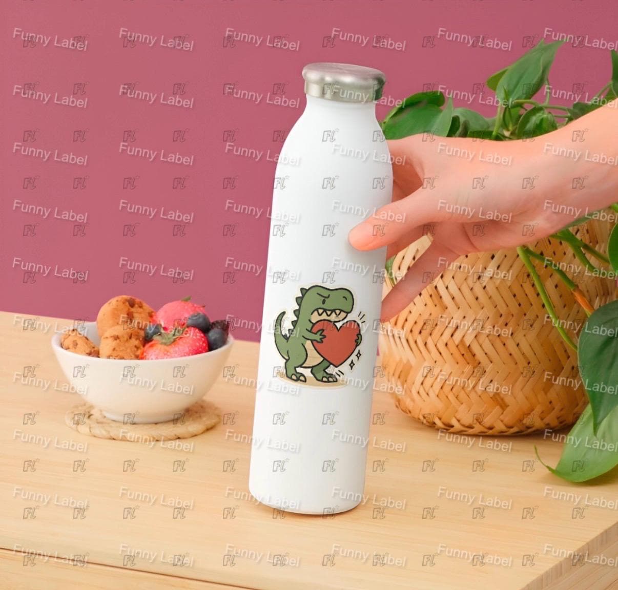 White bottle with a dinosaur design on a wooden table with a pink background