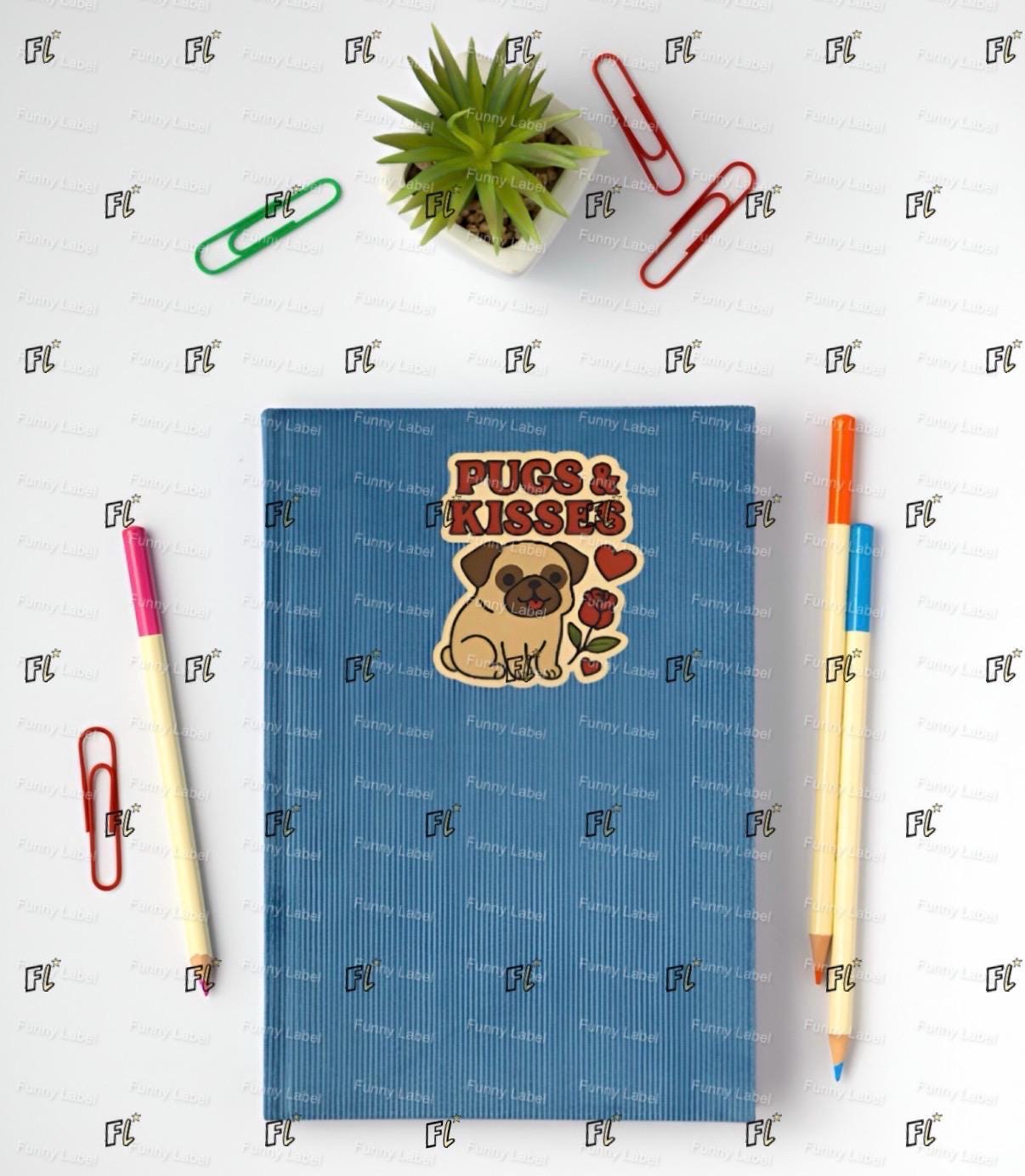 Blue notebook with a pug design titled 'Pugs & Kisses' on a white background with stationery items.