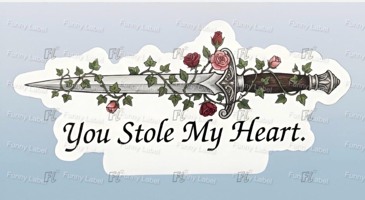 Decorative sticker with a sword, roses, and 'You Stole My Heart' text on a light blue background.